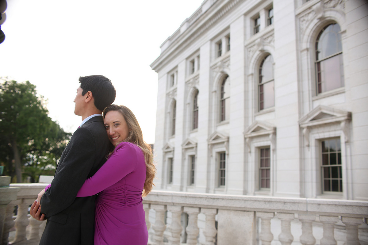 Gary and Natalie embracing upon a stone patio.